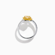 The 18K Two-Tone Gold Yellow and White Diamond Wrap Bypass Ring features two rectangular yellow stones bordered by smaller yellow gems on a spiral band, accented with sparkling white diamonds.