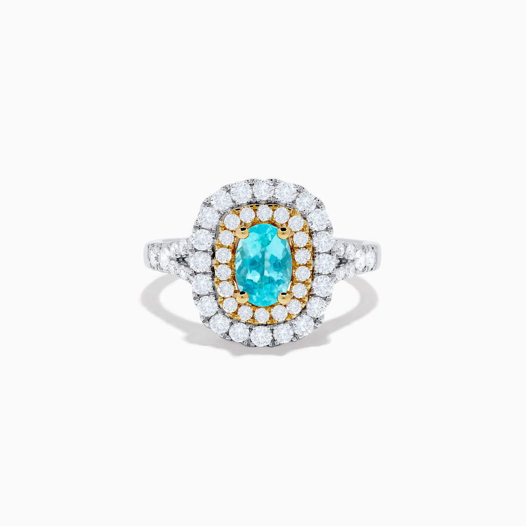 The 18K Two Tone Gold Paraiba and Diamond Double Halo Ring features an oval Paraiba centerpiece, surrounded by radiant yellow and white diamonds in a double halo, creating a striking layered effect.