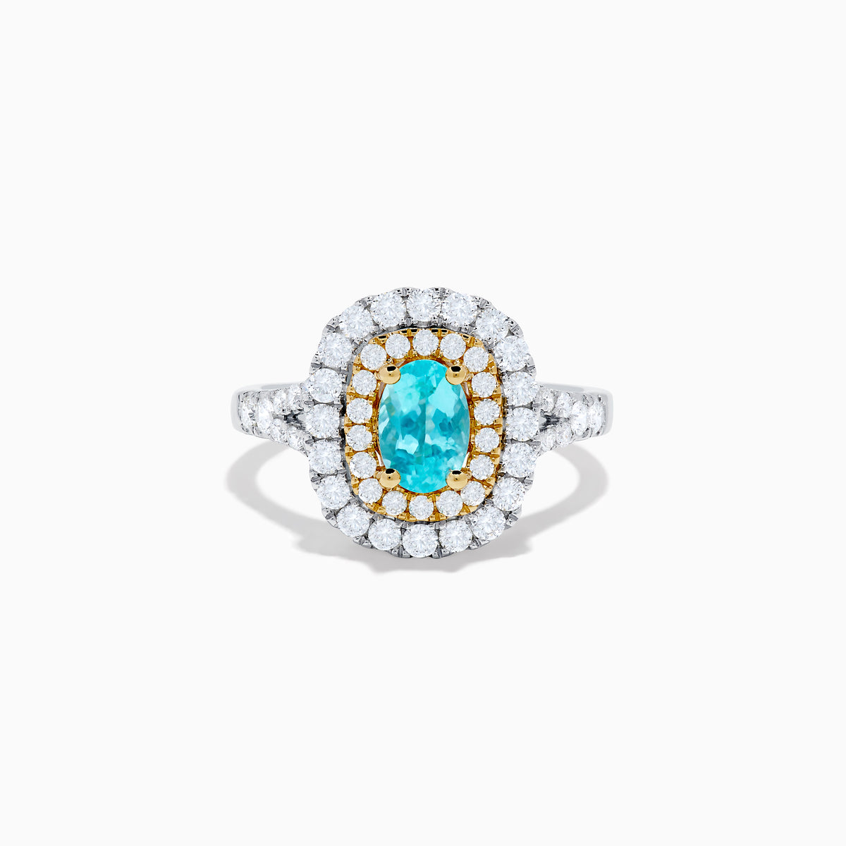 The 18K Two Tone Gold Paraiba and Diamond Double Halo Ring features an oval Paraiba centerpiece, surrounded by radiant yellow and white diamonds in a double halo, creating a striking layered effect.