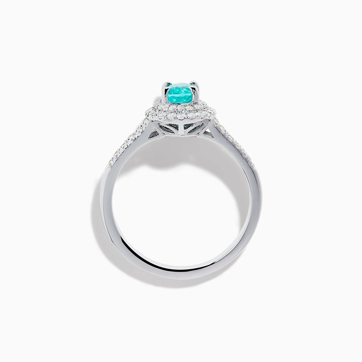 The 18K White Gold Paraiba and Diamond Ring showcases an oval Paraiba gemstone at the center, encircled by a halo of sparkling diamonds and accented with additional diamonds along its elegant split shank band.