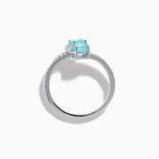 The 18K White Gold Paraiba and Diamond Bypass Ring features two oval Paraiba gemstones at each end of an open band, accented with small sparkling diamonds along the upper surface.