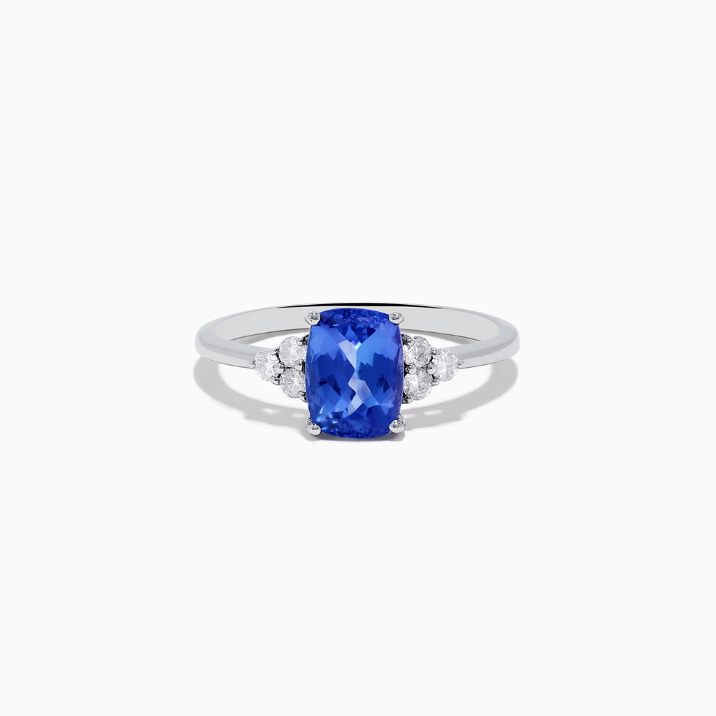 The Nahla Siri Sterling Silver Tanzanite and Diamond Ring showcases a rectangular, faceted blue tanzanite center, accented by small round diamonds on each side, all set in sterling silver against a white background.