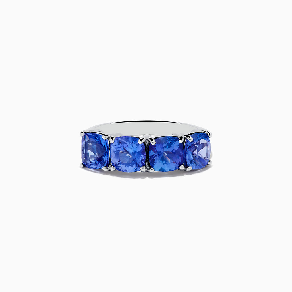 The Nahla Siri 925 Silver Tanzanite Ring showcases five large, cushion-cut tanzanite gemstones set in a row, displayed against a plain white background.