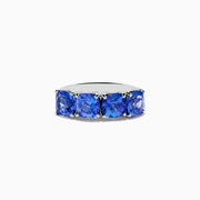The Nahla Siri 925 Silver Tanzanite Ring showcases five large, cushion-cut tanzanite gemstones set in a row, displayed against a plain white background.