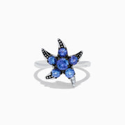 The 925 Sterling Silver Tanzanite and Diamond Starfish Ring features five round tanzanite gemstones and sparkling diamonds along one arm, displayed on a white background.
