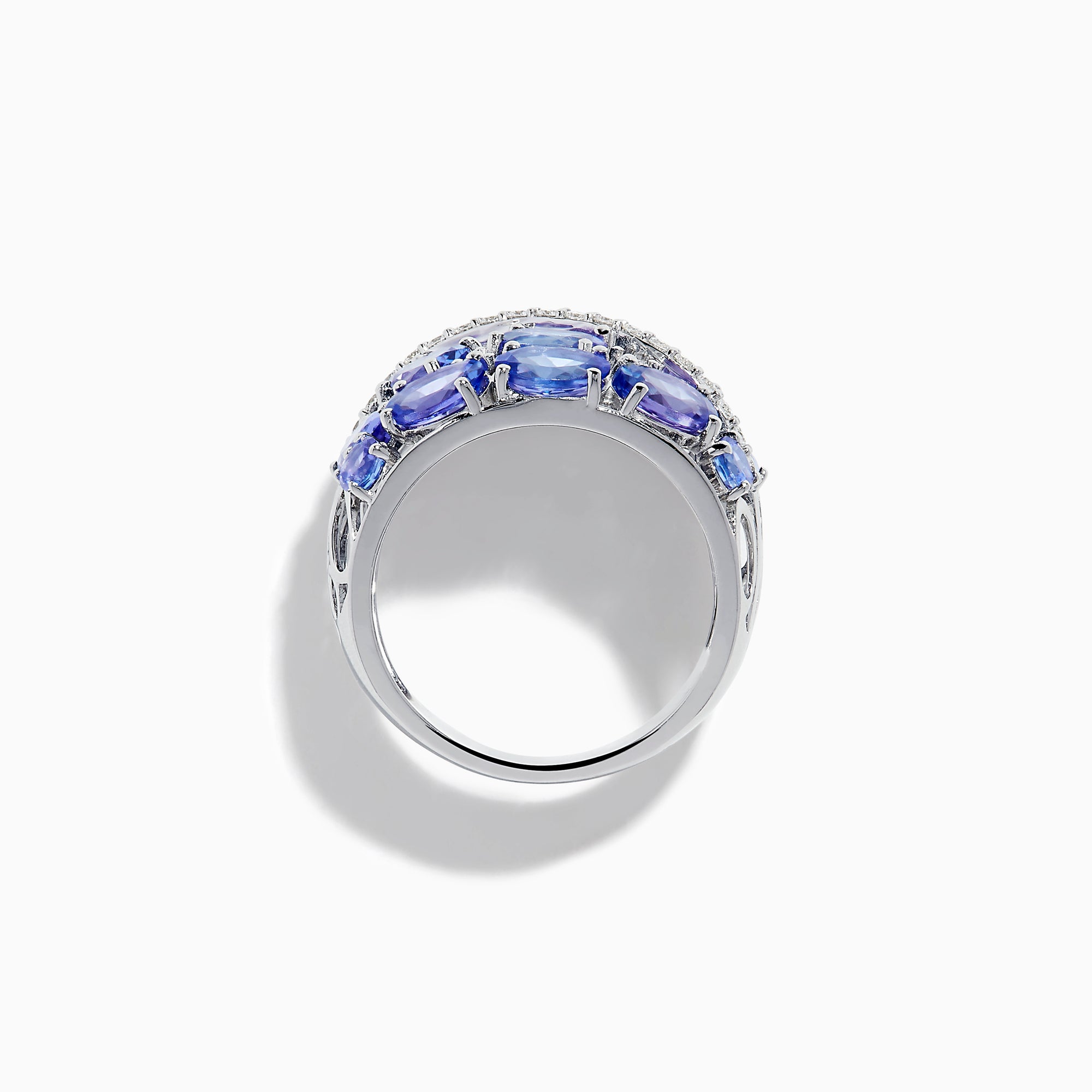The 14K White Gold Tanzanite and Diamond Statement Ring features multiple oval blue-violet tanzanites and round white diamonds in an elegant, layered design.