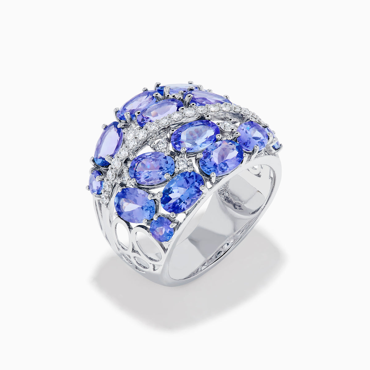 The 14K White Gold Tanzanite and Diamond Statement Ring features multiple oval blue-violet tanzanites and round white diamonds in an elegant, layered design.
