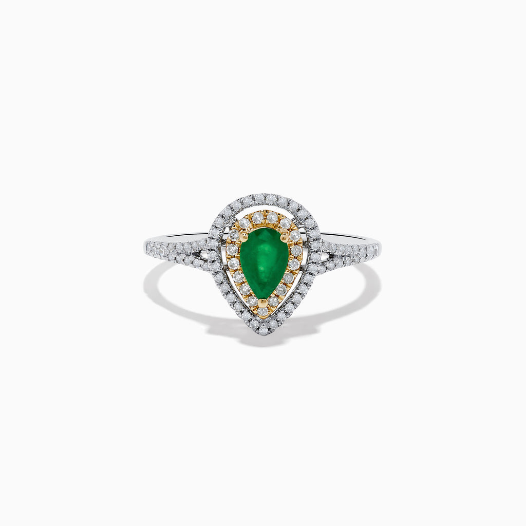 The 14K White and Yellow Gold Pear Shaped Double Diamond Halo Emerald Ring features a vivid emerald center, surrounded by white and yellow diamond halos, with a diamond-adorned band for extra brilliance.