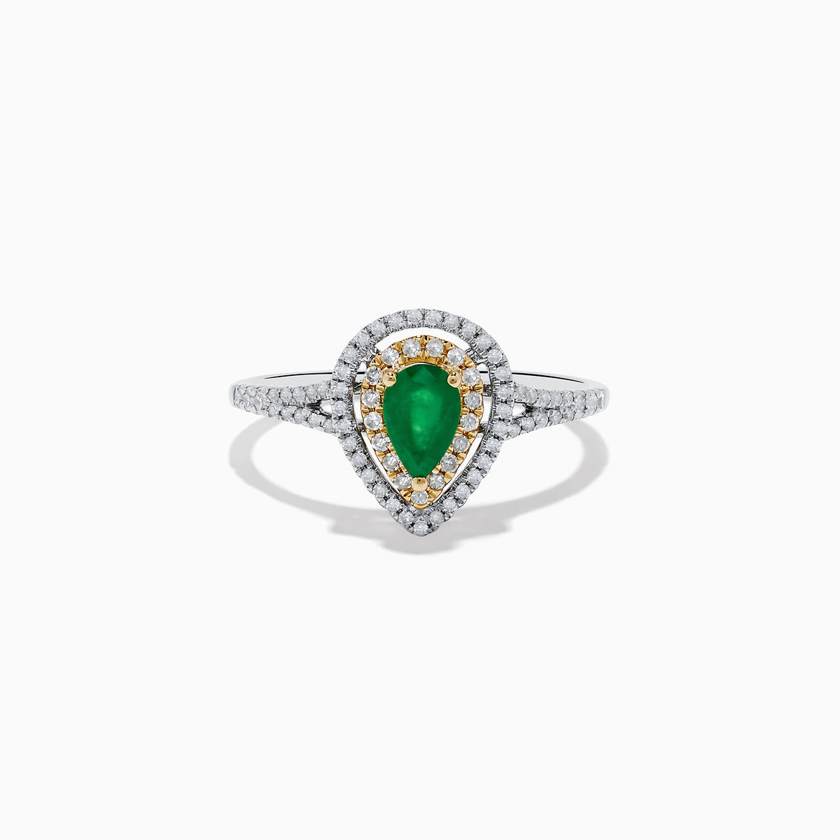 The 14K White and Yellow Gold Pear Shaped Double Diamond Halo Emerald Ring features a vivid emerald center, surrounded by white and yellow diamond halos, with a diamond-adorned band for extra brilliance.