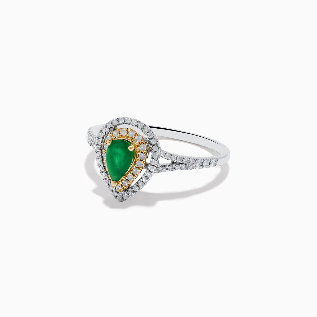 The 14K White and Yellow Gold Pear Shaped Double Diamond Halo Emerald Ring features a vivid emerald center, surrounded by white and yellow diamond halos, with a diamond-adorned band for extra brilliance.