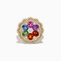 The Watercolors 14K Yellow Gold Multi Sapphire and Diamond Ring features a flower design with sapphire petals, a central white gemstone, and two diamond layers in a scalloped border.