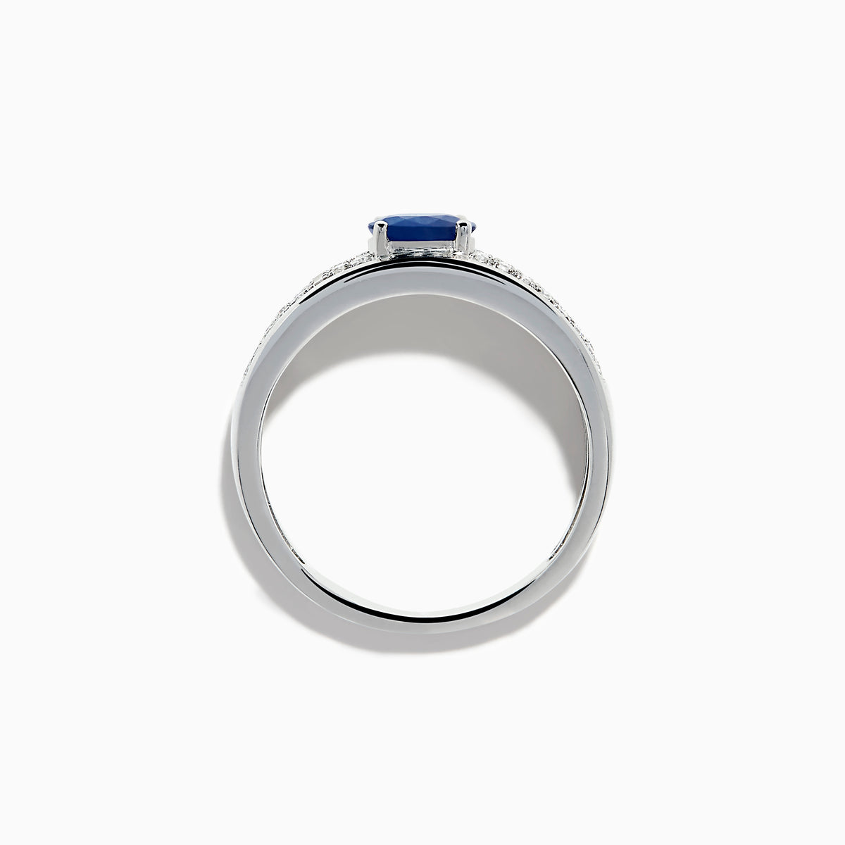 The 925 Sterling Silver Blue Sapphire and Diamond Ring showcases an oval blue sapphire centerpiece accented by two rows of sparkling round white diamonds along the band.