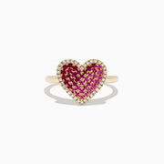 The Novelty 14K Yellow Gold Pink Sapphire, Ruby and Diamond Heart Ring features a heart-shaped design with central pink sapphire and ruby gemstones, surrounded by small white diamonds and shown on a white background.