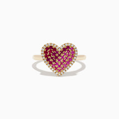 The Novelty 14K Yellow Gold Pink Sapphire, Ruby and Diamond Heart Ring features a heart-shaped design with central pink sapphire and ruby gemstones, surrounded by small white diamonds and shown on a white background.