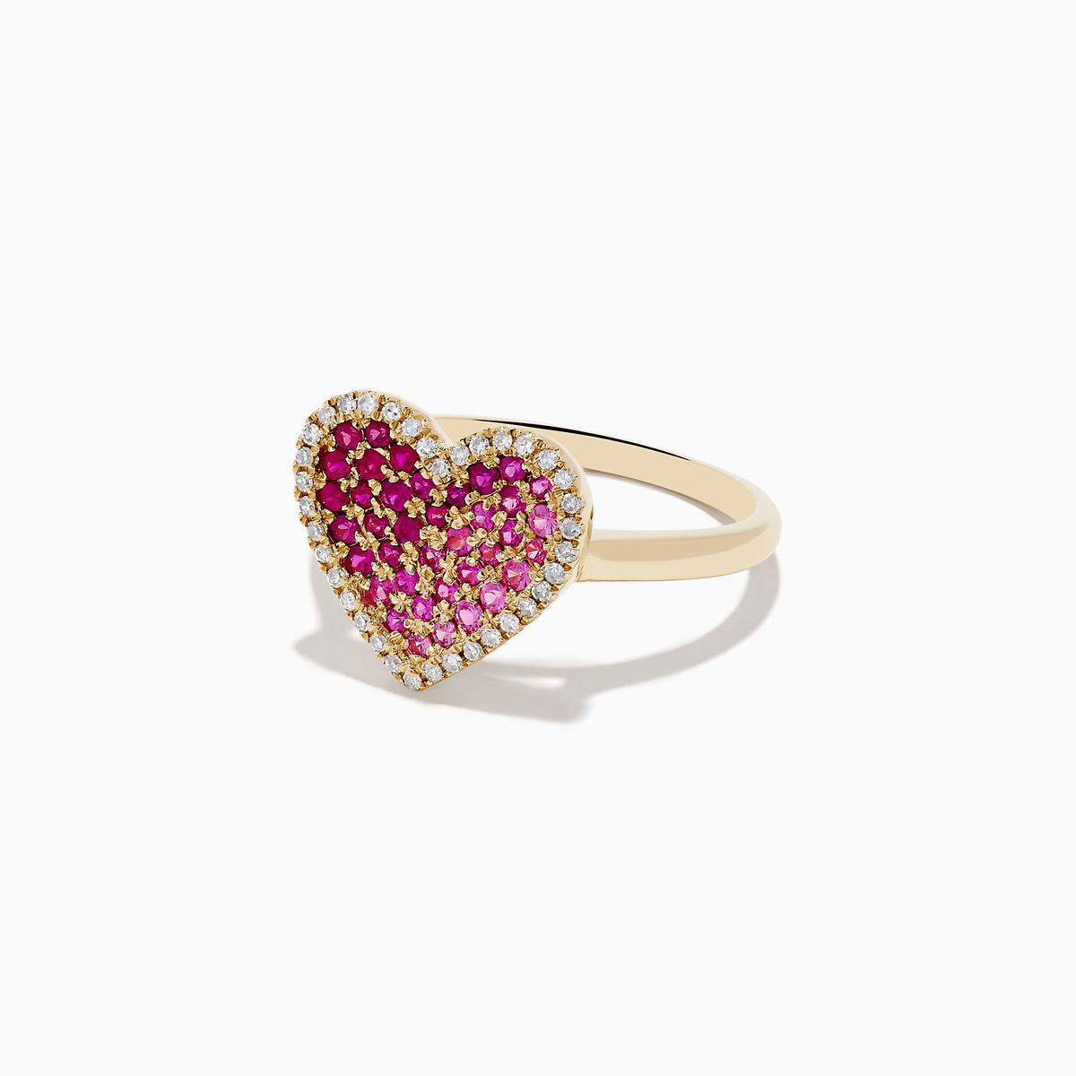 The Novelty 14K Yellow Gold Pink Sapphire, Ruby and Diamond Heart Ring features a heart-shaped design with central pink sapphire and ruby gemstones, surrounded by small white diamonds and shown on a white background.