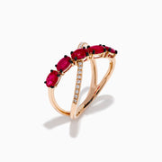 The 14K Rose Gold Diamond and Natural Ruby Criss Cross Ring features five oval red rubies on one band and small white diamonds on the other, set against a white background.