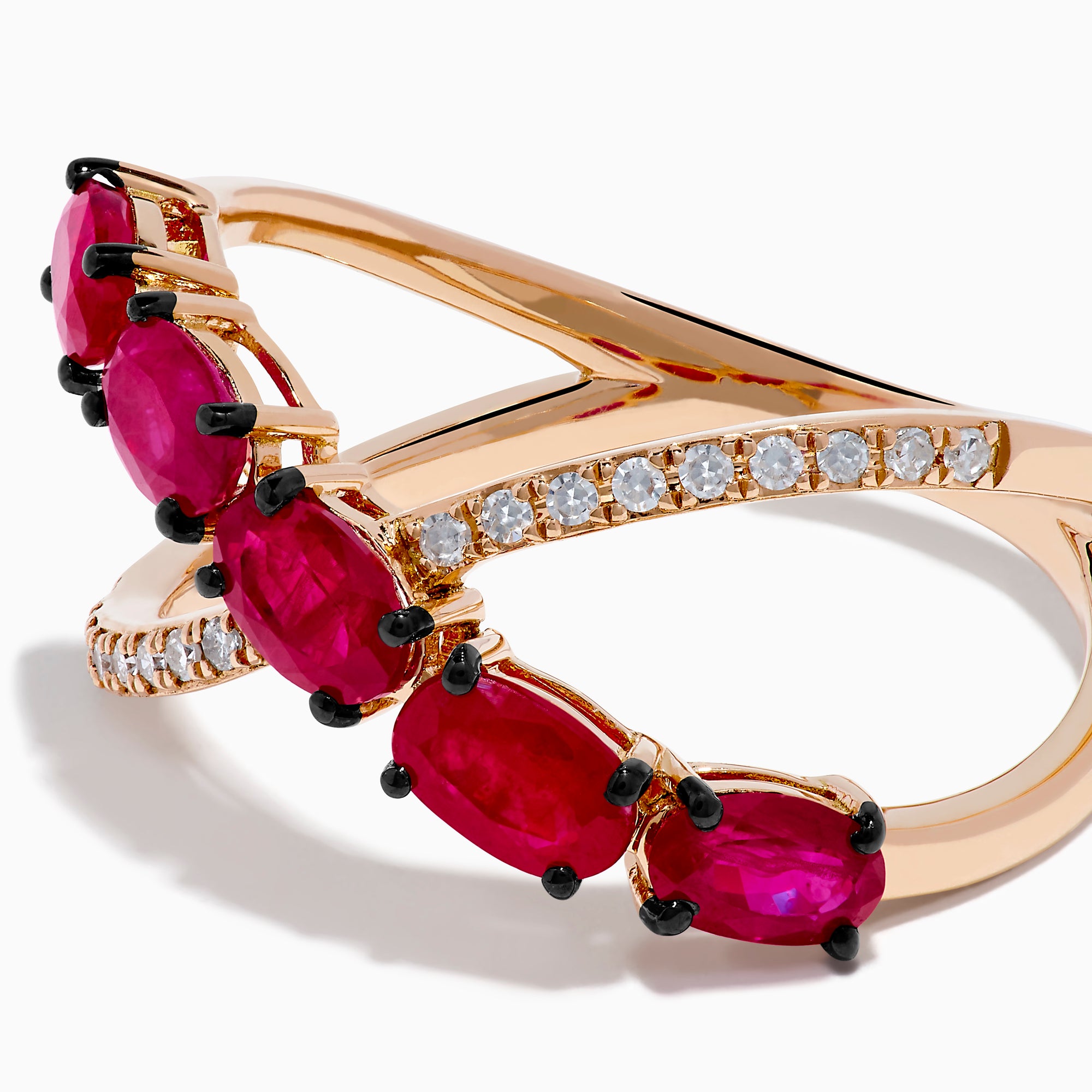 The 14K Rose Gold Diamond and Natural Ruby Criss Cross Ring features five oval red rubies on one band and small white diamonds on the other, set against a white background.