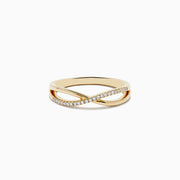 The Trio 14K 3-Tone Gold Diamond Stackable Crossover Rings Set of 3 features yellow, white, and rose gold bands, each with a crossover infinity design and sparkling diamond accents—perfect for stacking or wearing individually.