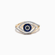The Novelty 14K Yellow Gold Blue Sapphire and Diamond Evil Eye Ring showcases an eye-shaped design with a central blue sapphire, surrounded by blue and clear stones, and finished with an outer layer of diamonds forming the eye outline.