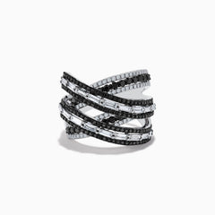 The 14K White Gold Black and White Diamond Criss Cross Ring features overlapping bands set with alternating rows of black and white diamonds for a striking, modern look.