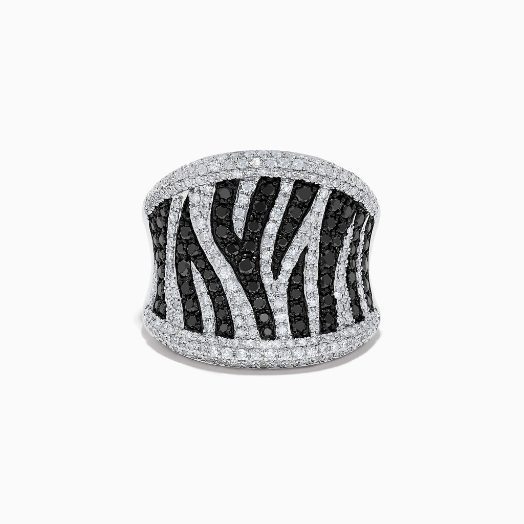 The 14K White Gold Black and White Diamond Zebra Print Ring features a striking zebra-striped pattern, with sparkling black and white diamonds set in a wide, slightly curved band for a bold, textured finish.