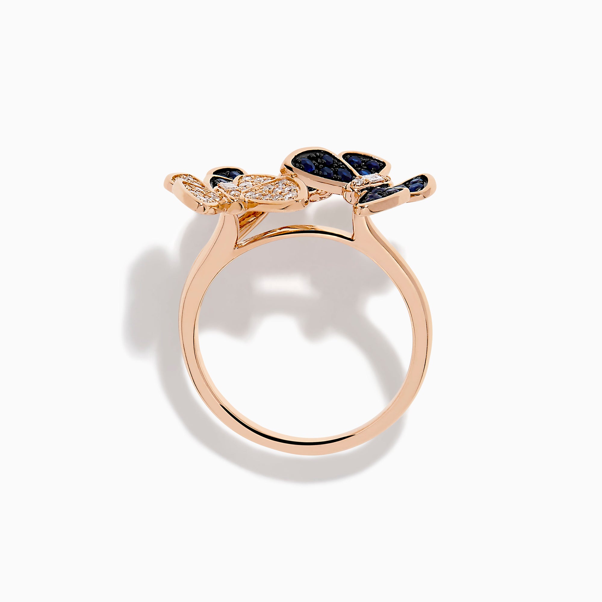 The 14K Rose Gold Diamond and Natural Sapphire Butterfly Ring showcases three butterflies—two accented with natural sapphires and one with diamonds—set on a plain rose gold band.