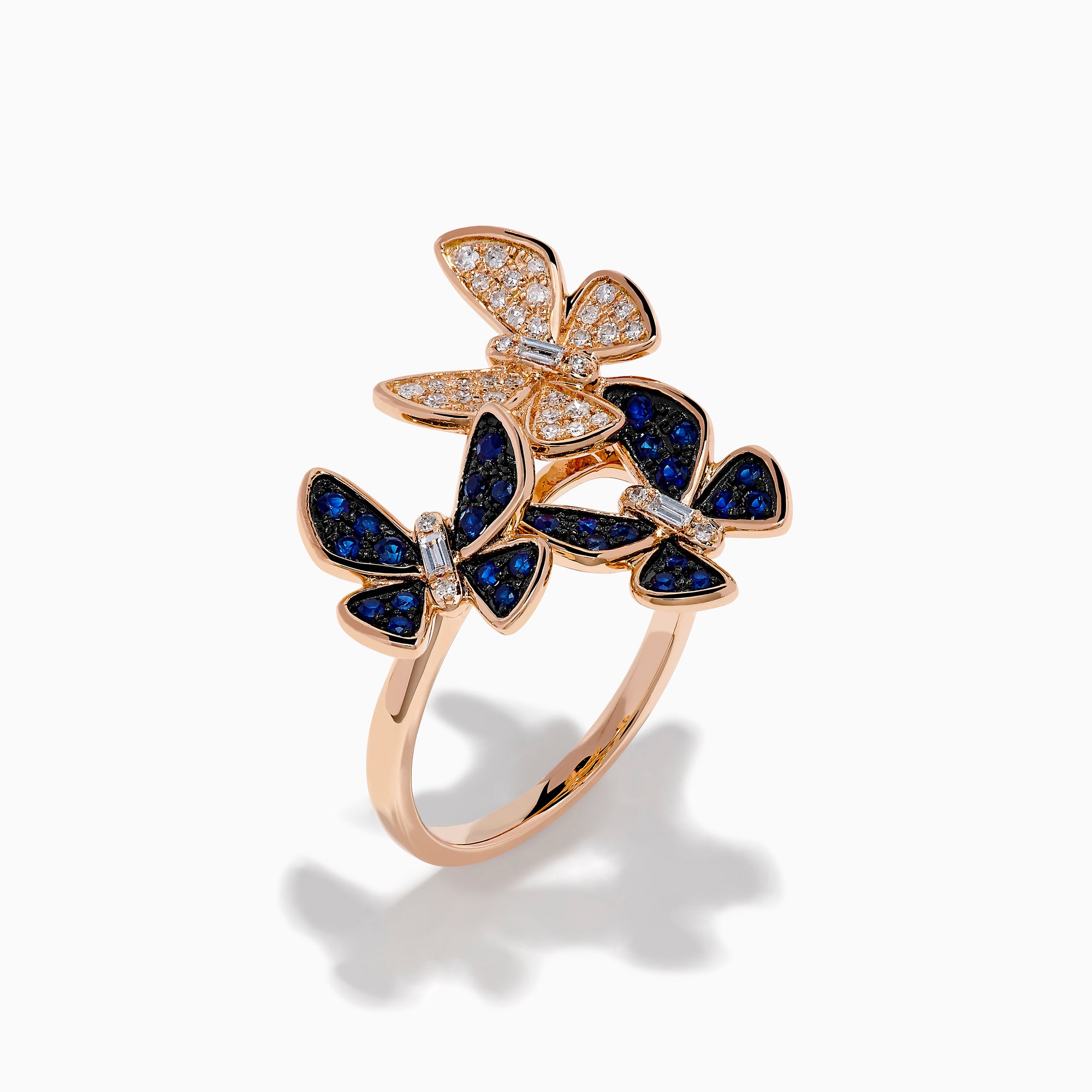 The 14K Rose Gold Diamond and Natural Sapphire Butterfly Ring showcases three butterflies—two accented with natural sapphires and one with diamonds—set on a plain rose gold band.