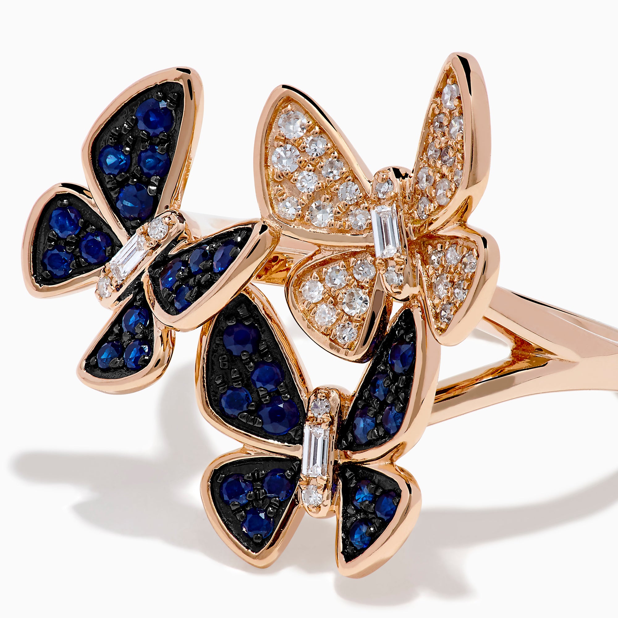 The 14K Rose Gold Diamond and Natural Sapphire Butterfly Ring showcases three butterflies—two accented with natural sapphires and one with diamonds—set on a plain rose gold band.