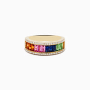 The Watercolors 14K Yellow Gold Multi Sapphire and Diamond Ring features a row of rectangular sapphires in rainbow order, bordered by sparkling white diamonds, all set against a plain white background.