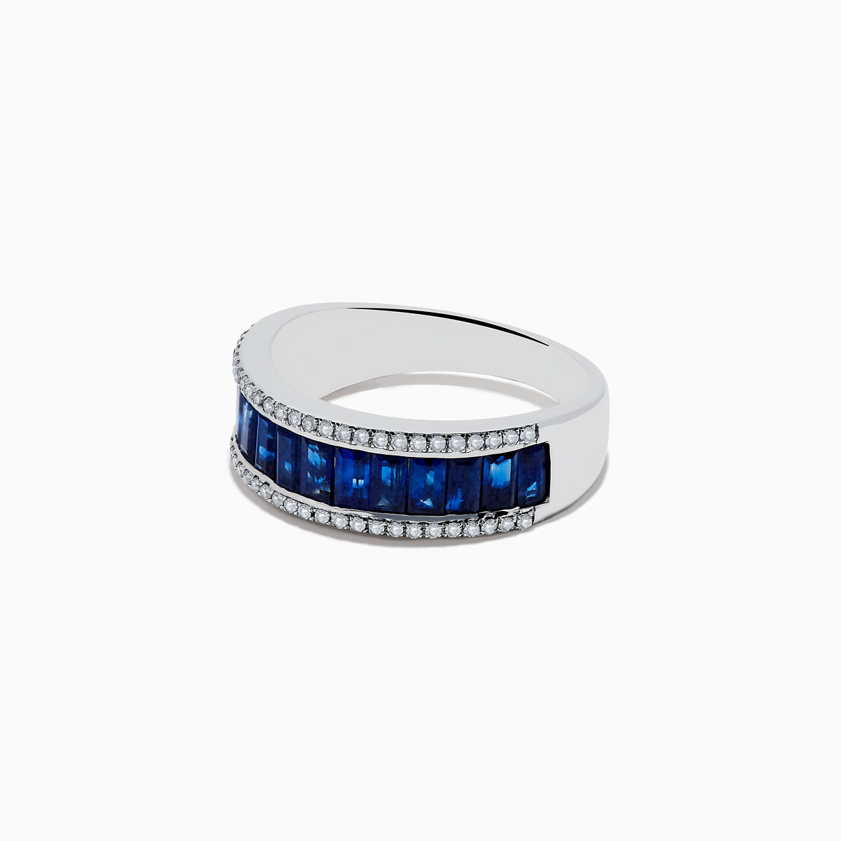 The Royale Bleu 14K White Gold Blue Sapphire and Diamond Ring showcases a central row of rectangular blue sapphires bordered by rows of sparkling diamonds, set against a white background.