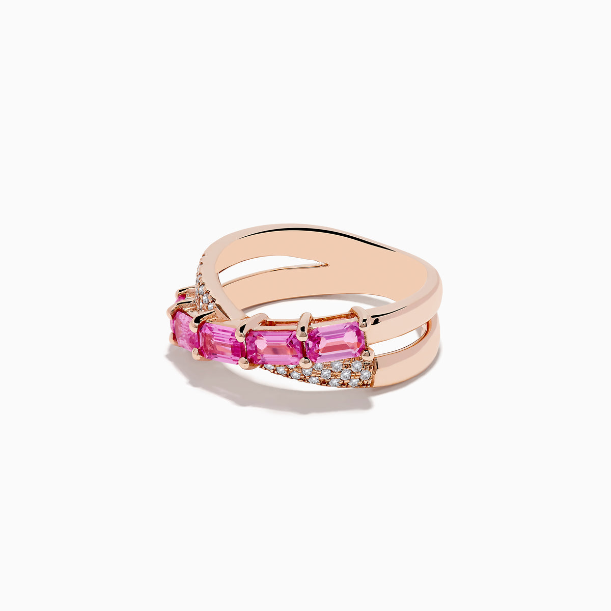 The 14K Rose Gold Pink Sapphire and Diamond Criss Cross Ring features a crisscross design set with rectangular pink sapphires and small round diamonds for an elegant, modern look.