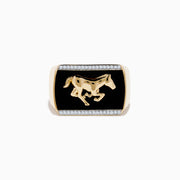 The Mens 14K Yellow Gold Onyx and Diamond Running Horse Ring features a raised horse on a sleek black onyx rectangular face, accented with diamonds along the top and bottom edges.