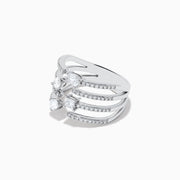 The Pave Classica 14k White Gold Open Shank Diamond Ring showcases sparkling pear and oval-shaped diamonds set across open bands, each lined with pavé diamonds. The ring is shown against a white background.