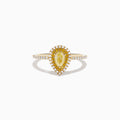 The Canare 14K Yellow Gold White and Yellow Diamond Ring features a pear-shaped yellow diamond with a white diamond halo and diamond-accented band, shown on a white background.