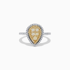 The Canare 14K Two Tone White and Yellow Diamond Ring showcases clustered yellow diamonds encircled by a double halo of white diamonds, set on a diamond-studded silver band for a striking, elegant look.