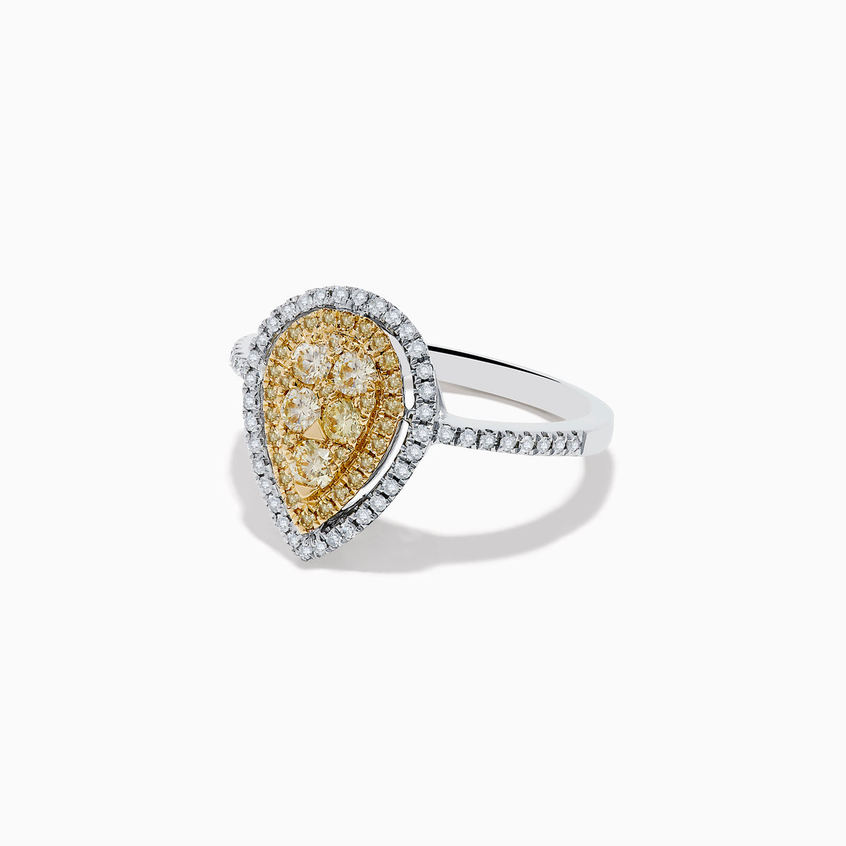 The Canare 14K Two Tone White and Yellow Diamond Ring showcases clustered yellow diamonds encircled by a double halo of white diamonds, set on a diamond-studded silver band for a striking, elegant look.