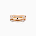 The Pave Rose 14K Gold Diamond Band Ring features a faceted center band bordered by rows of small white diamonds, showcased on a plain white background.