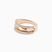 The Pave Rose 14K Gold Diamond Band Ring features a faceted center band bordered by rows of small white diamonds, showcased on a plain white background.