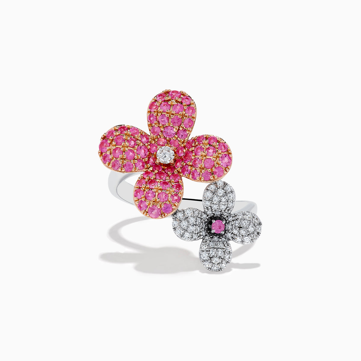 The Nature 14k Two Tone Gold Pink Sapphire and Diamond Flower Ring features two blooms—one with pink sapphires and a diamond center, the other with diamonds and a pink sapphire center—shown on a white background.