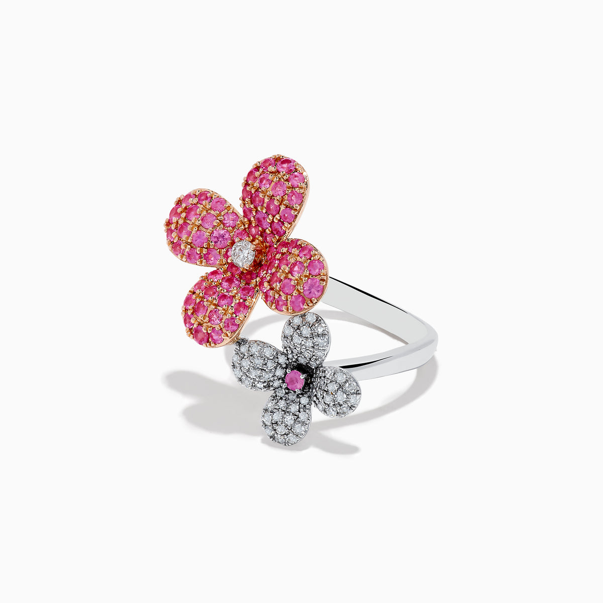 The Nature 14k Two Tone Gold Pink Sapphire and Diamond Flower Ring features two blooms—one with pink sapphires and a diamond center, the other with diamonds and a pink sapphire center—shown on a white background.