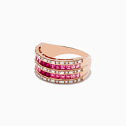 The 14k Rose Gold Princess Cut Pink Tourmaline and Ruby Ring 1.61 TCW features three rows of square pink stones and rubies, bordered by sparkling clear stones, all set in a wide band with a white backdrop.