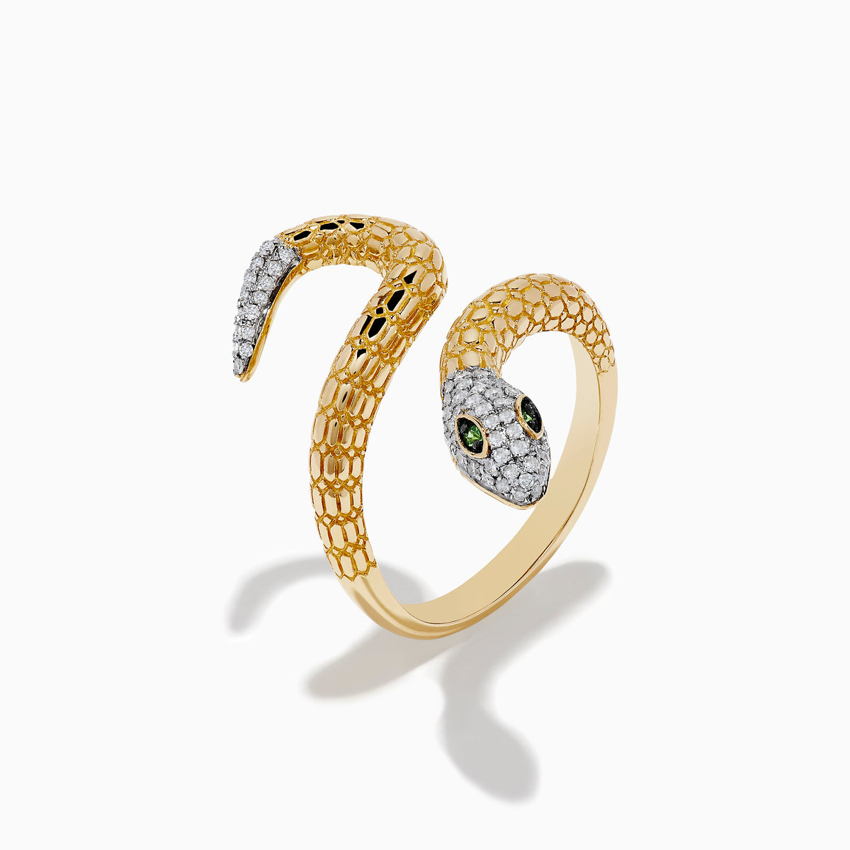 The Safari 14k Yellow Gold Snake Diamond Ring features a coiled snake with textured scale-like details, diamond-encrusted head and tail, and striking green gemstone eyes—an Effy Safari-inspired statement piece.