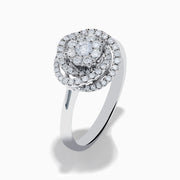 The Bouquet 14K White Gold Diamond Spiral Ring features a round diamond cluster encircled by two halos of sparkling diamonds on a polished band—ideal for lovers of the Diamond Spiral Ring style.