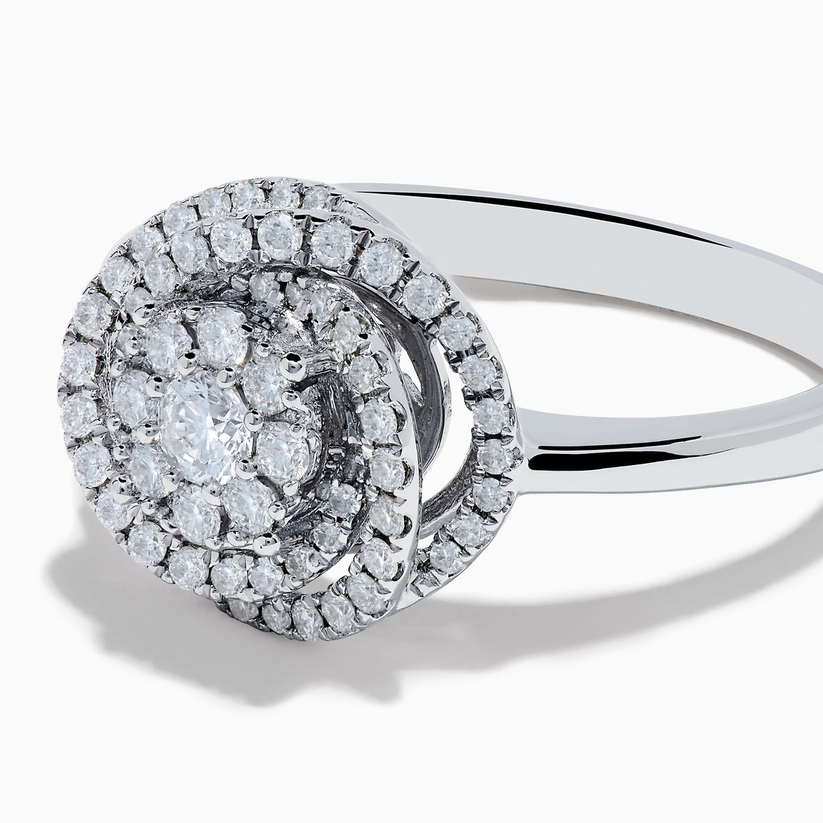 The Bouquet 14K White Gold Diamond Spiral Ring features a round diamond cluster encircled by two halos of sparkling diamonds on a polished band—ideal for lovers of the Diamond Spiral Ring style.