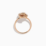 The Pave Rose 14K Rose Gold Diamond Rose Ring showcases a central round diamond encircled by concentric pave-set diamonds, creating an elegant spiral floral design.