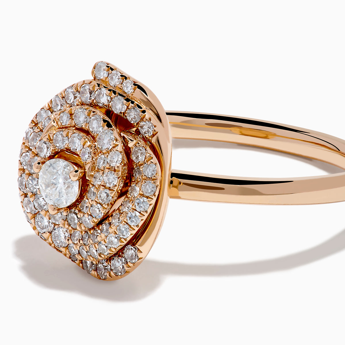The Pave Rose 14K Rose Gold Diamond Rose Ring showcases a central round diamond encircled by concentric pave-set diamonds, creating an elegant spiral floral design.