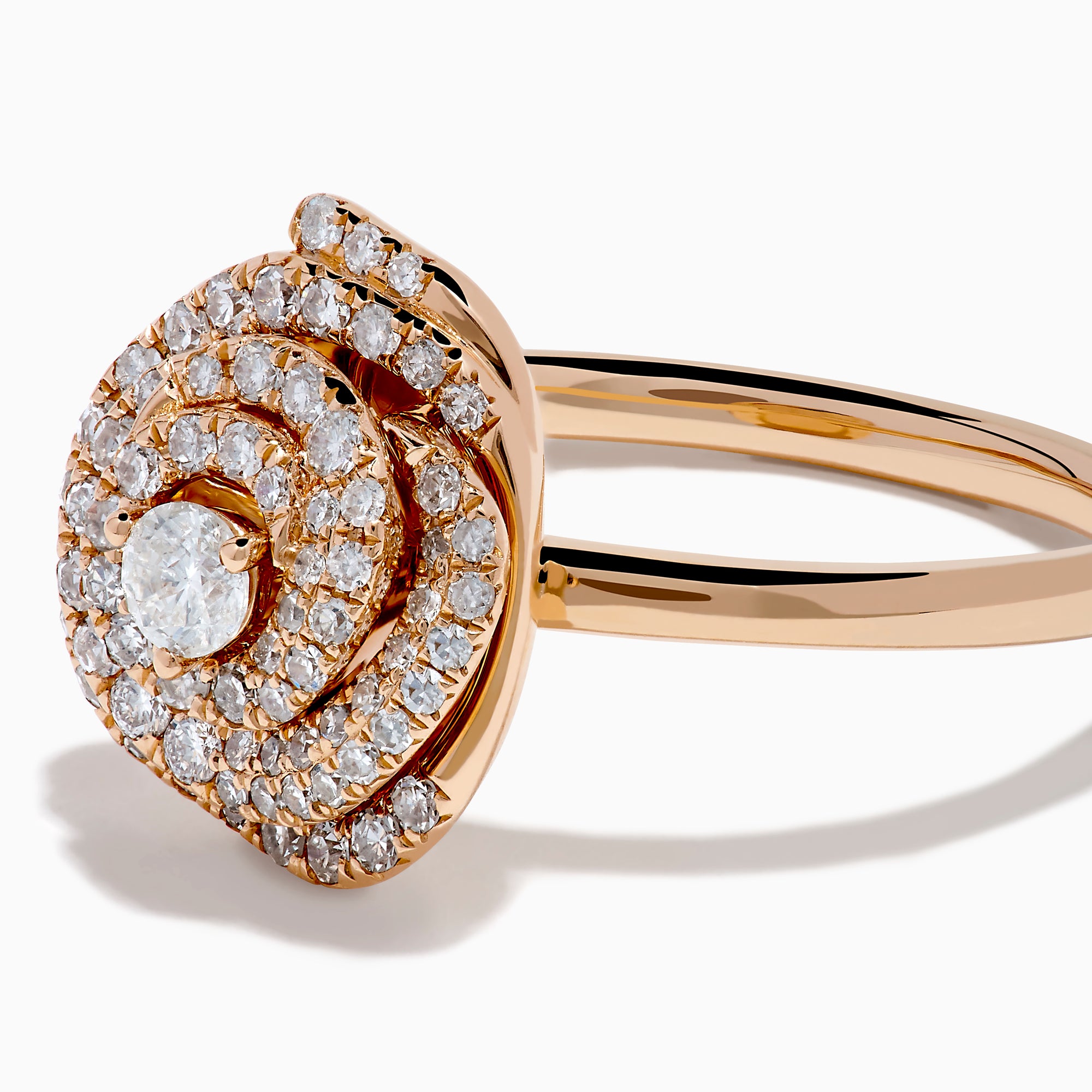 The Pave Rose 14K Rose Gold Diamond Rose Ring showcases a central round diamond encircled by concentric pave-set diamonds, creating an elegant spiral floral design.