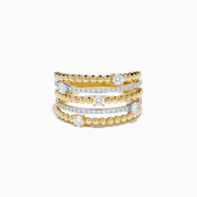 The 14K Two Tone Gold Diamond Beaded Multi Row Ring features four stacked bands with beaded textures and sparkling diamonds set in a symmetrical pattern.