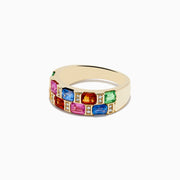 The 14K Yellow Gold Multi Sapphire and Diamond Ring features a wide band adorned with rectangular sapphires in pink, blue, green, yellow, and orange, arranged in two vibrant rows around the band.