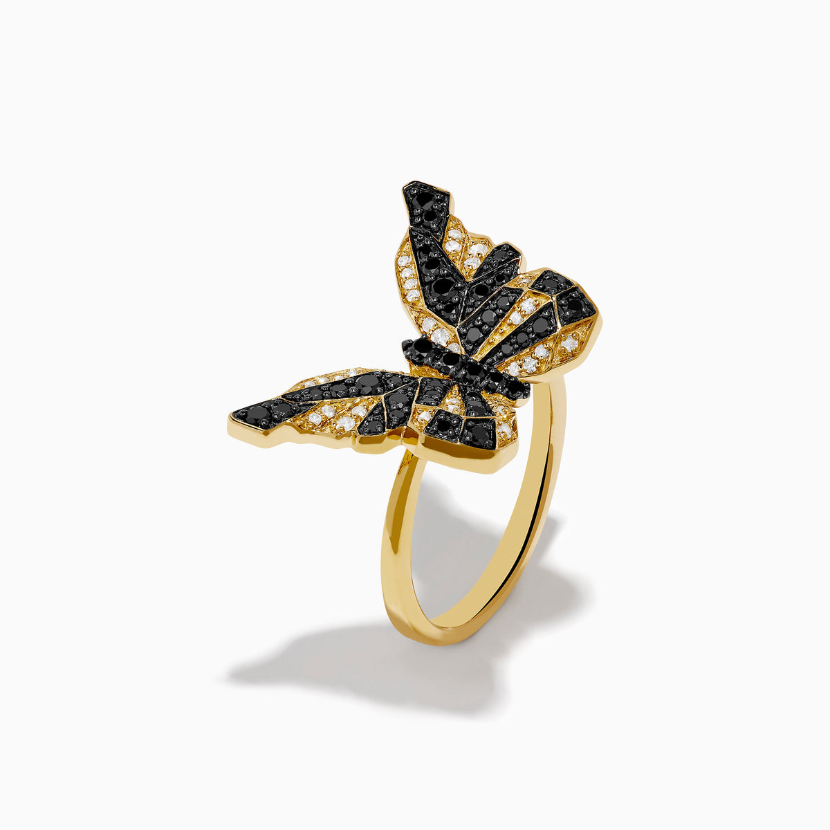 The Safari 14K Yellow Gold Black & White Diamond Butterfly Ring features a butterfly design with black and white diamonds segmented on its wings, set against a white background.